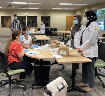 Students learning in the Wayne State vaccination training lab